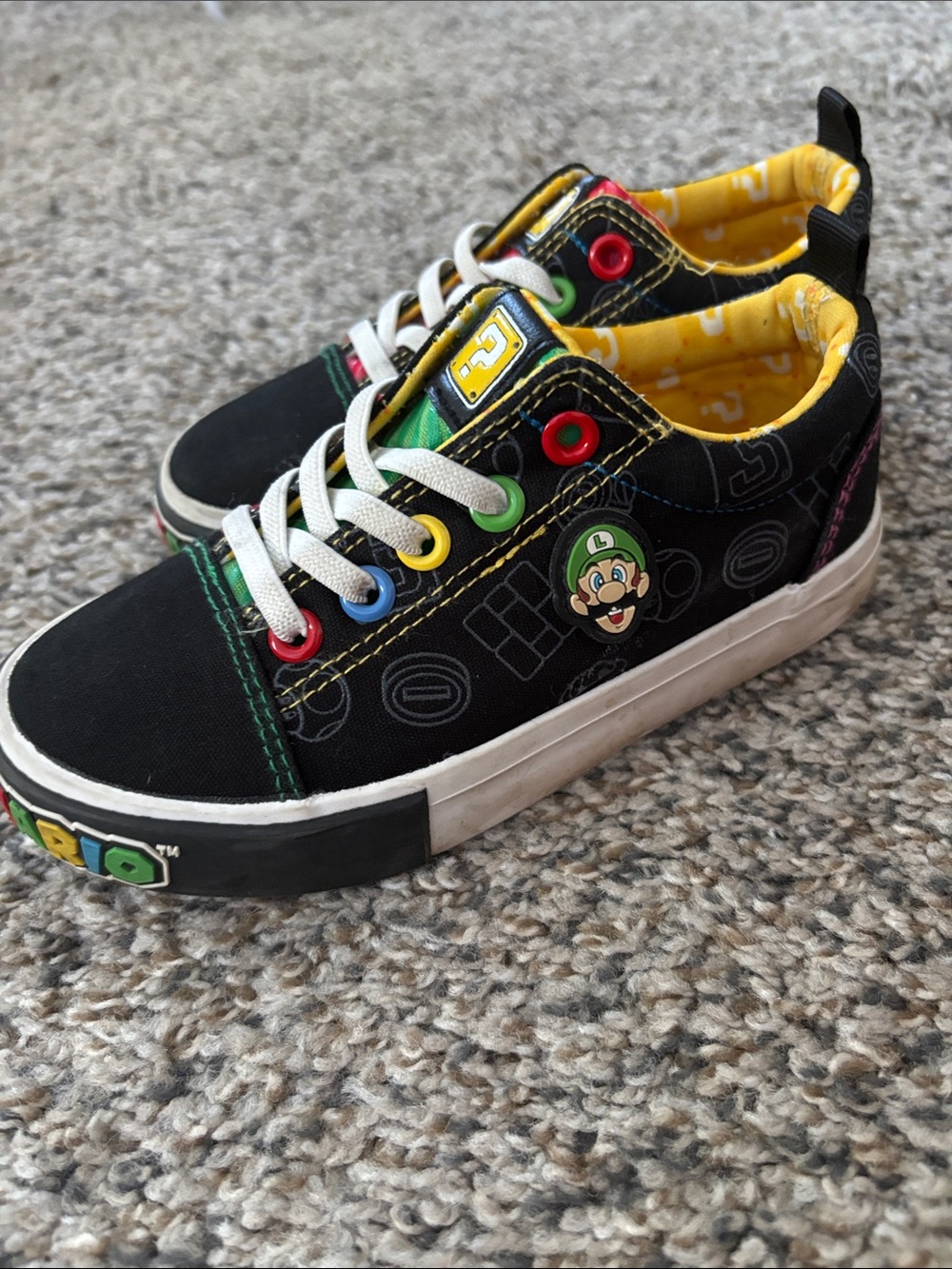 Nintendo Kids Black Sneakers with Yellow Lining and Multi-Colored Eyelets